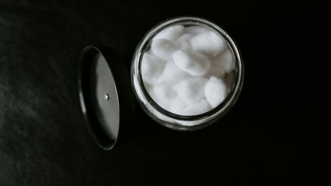 Container with cotton balls illustrating an AI partnership between L’Oréal and IBM to use foundation models to improve sustainability and innovation in the beauty and cosmetics industry.